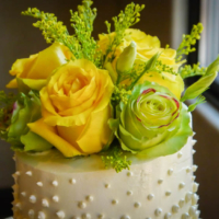 Closeup of flowers on wedding cake