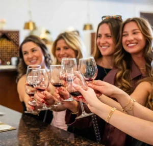 Group of young women toasting to a bachelorette party at Danza Del Sol Winery